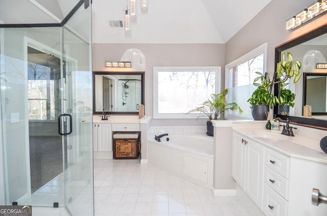 6450 Oak Valley Dr, Cumming, GA 30040 - full bath featuring lofted ceiling, vanity, a bath, a stall shower, and tile patterned floors