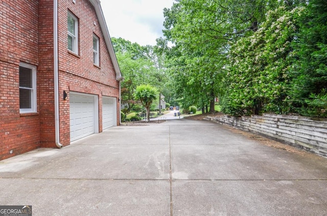6450 Oak Valley Dr, Cumming, GA 30040 - garage featuring concrete driveway