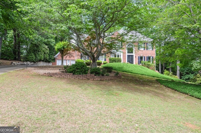6450 Oak Valley Dr, Cumming, GA 30040 - view of front facade with brick siding and a front lawn