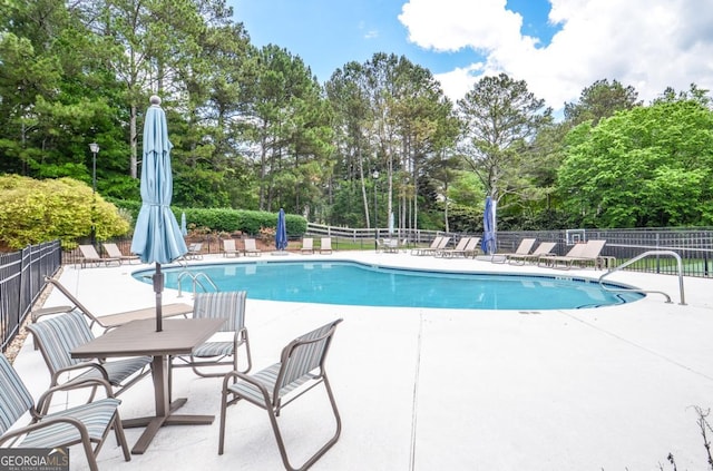 6450 Oak Valley Dr, Cumming, GA 30040 - community pool with view of scattered trees and a patio