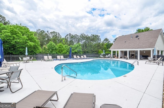 6450 Oak Valley Dr, Cumming, GA 30040 - community pool with a patio and view of scattered trees