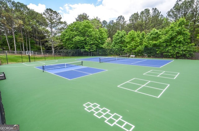 6450 Oak Valley Dr, Cumming, GA 30040 - view of community with a tennis court