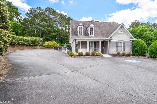 6450 Oak Valley Dr, Cumming, GA 30040 - cape cod house with a porch