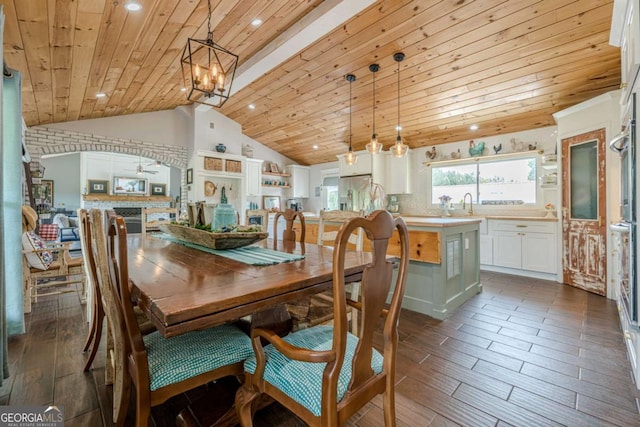 27 Graham Rd, Dallas, GA 30132 - dining space with lofted ceiling, a chandelier, wood ceiling, dark wood-style flooring, and recessed lighting
