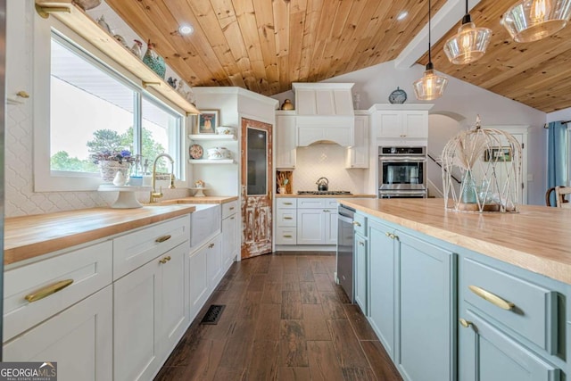 27 Graham Rd, Dallas, GA 30132 - kitchen featuring wooden counters, wooden ceiling, a sink, dark wood-style flooring, and backsplash
