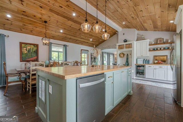27 Graham Rd, Dallas, GA 30132 - kitchen featuring appliances with stainless steel finishes, lofted ceiling, butcher block counters, wine cooler, and dark wood finished floors