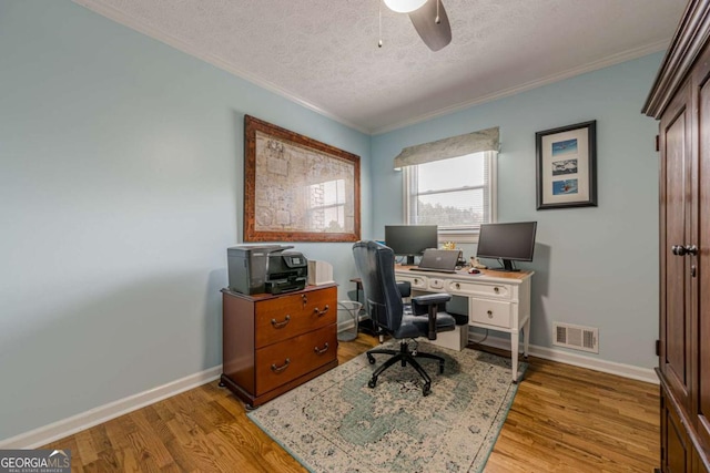 27 Graham Rd, Dallas, GA 30132 - home office with ornamental molding, a textured ceiling, light wood-type flooring, baseboards, and ceiling fan