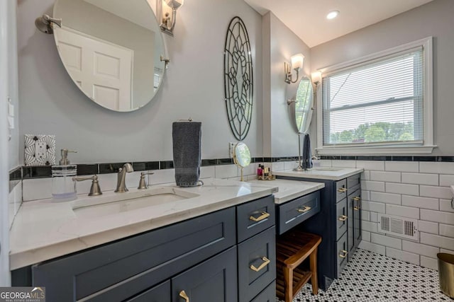 27 Graham Rd, Dallas, GA 30132 - bathroom featuring tile walls, vanity, tile patterned floors, and a wainscoted wall