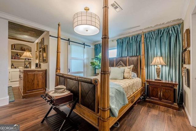 27 Graham Rd, Dallas, GA 30132 - bedroom featuring a barn door, ornamental molding, dark wood-style floors, and baseboards
