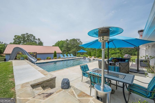 27 Graham Rd, Dallas, GA 30132 - swimming pool featuring a water slide and a patio area