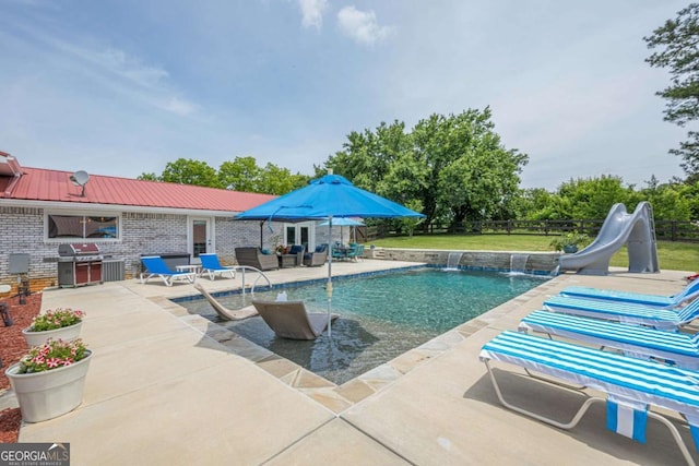 27 Graham Rd, Dallas, GA 30132 - outdoor pool featuring area for grilling, a water slide, a patio area, and an outdoor living space