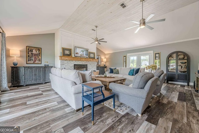 27 Graham Rd, Dallas, GA 30132 - living room featuring lofted ceiling, ceiling fan, wood finished floors, and a fireplace