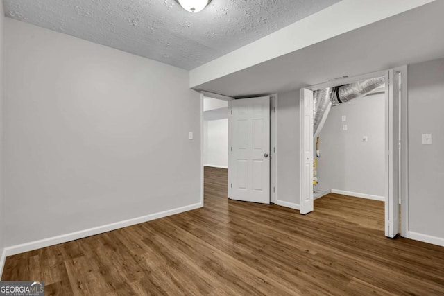 2184 Cherokee Valley Cir, Lithonia, GA 30058 - finished basement with wood finished floors and a textured ceiling