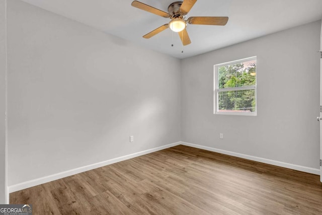 2184 Cherokee Valley Cir, Lithonia, GA 30058 - spare room with wood finished floors and a ceiling fan