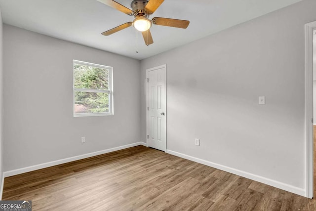 2184 Cherokee Valley Cir, Lithonia, GA 30058 - spare room featuring wood finished floors and ceiling fan
