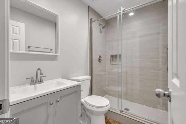 2184 Cherokee Valley Cir, Lithonia, GA 30058 - full bathroom featuring vanity, a shower stall, and wood finished floors