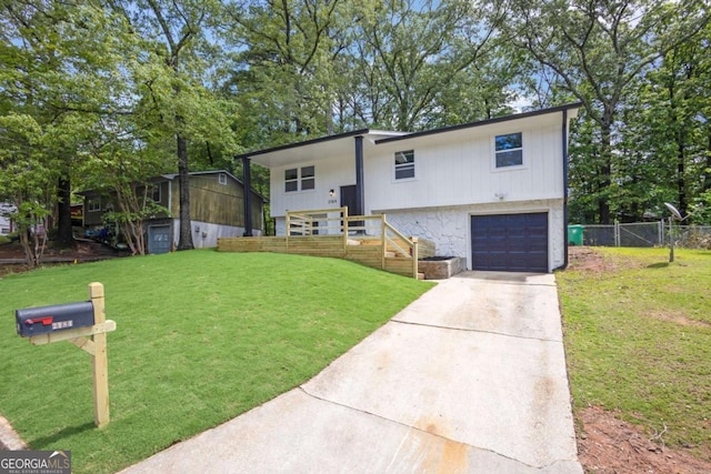 view of front of home featuring concrete driveway and a garage