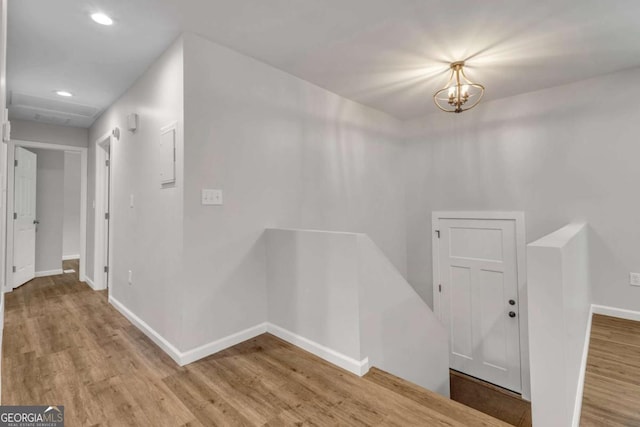 2184 Cherokee Valley Cir, Lithonia, GA 30058 - corridor featuring an upstairs landing, wood finished floors, recessed lighting, and a chandelier