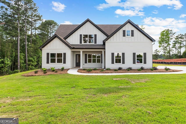 1356 Waymanville Rd, Thomaston, GA 30286 - modern inspired farmhouse featuring roof with shingles, board and batten siding, and a front yard