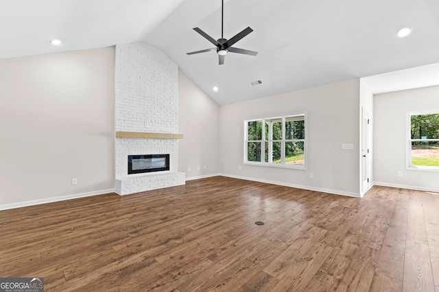 1356 Waymanville Rd, Thomaston, GA 30286 - unfurnished living room with ceiling fan, wood finished floors, a brick fireplace, baseboards, and recessed lighting
