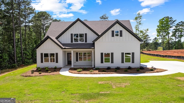 1356 Waymanville Rd, Thomaston, GA 30286 - modern farmhouse featuring board and batten siding, covered porch, roof with shingles, and a front lawn