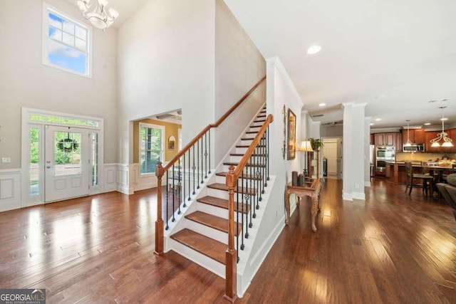 3230 Sundew Dr NW, Acworth, GA 30101 - entryway featuring stairs, a chandelier, dark wood-type flooring, decorative columns, and recessed lighting