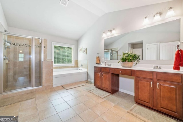 3230 Sundew Dr NW, Acworth, GA 30101 - full bath with vaulted ceiling, a shower stall, tile patterned floors, double vanity, and a garden tub