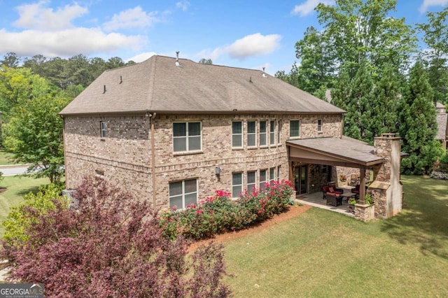 3230 Sundew Dr NW, Acworth, GA 30101 - rear view of property with a patio area, a lawn, roof with shingles, brick siding, and an outdoor living space