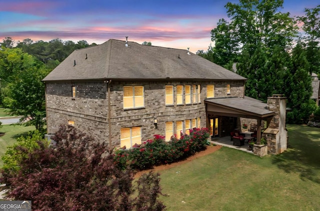 3230 Sundew Dr NW, Acworth, GA 30101 - rear view of property featuring a patio area, a lawn, and roof with shingles