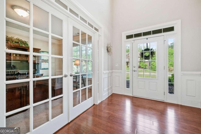 3230 Sundew Dr NW, Acworth, GA 30101 - entryway with french doors, a decorative wall, wainscoting, plenty of natural light, and wood finished floors