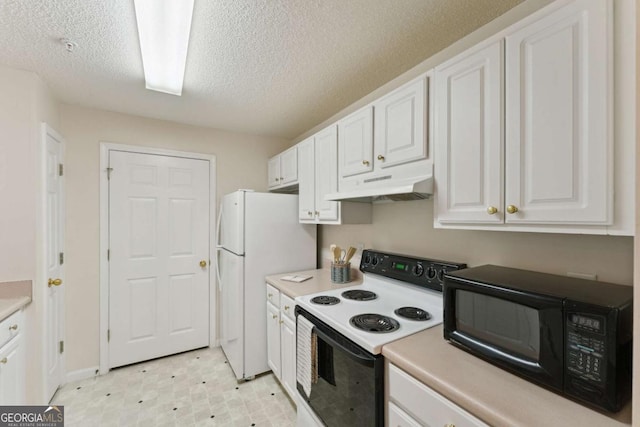 6306 Walden Park Dr, Savannah, GA 31410 - kitchen featuring under cabinet range hood, range with electric cooktop, black microwave, freestanding refrigerator, and white cabinets