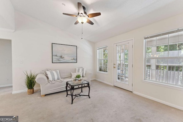 6306 Walden Park Dr, Savannah, GA 31410 - carpeted living room featuring vaulted ceiling, a ceiling fan, and baseboards