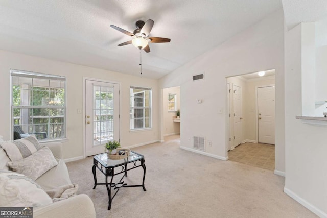 6306 Walden Park Dr, Savannah, GA 31410 - living room featuring vaulted ceiling, ceiling fan, light colored carpet, and baseboards