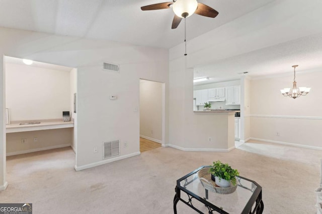 6306 Walden Park Dr, Savannah, GA 31410 - unfurnished living room featuring light carpet, ceiling fan, a chandelier, and baseboards