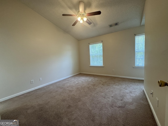 218 Osmanthus Way, Canton, GA 30114 - unfurnished room featuring a textured ceiling, carpet, a ceiling fan, baseboards, and vaulted ceiling