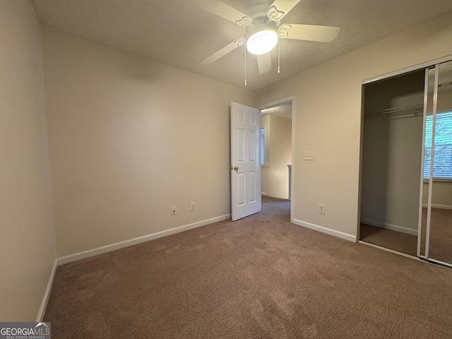 218 Osmanthus Way, Canton, GA 30114 - unfurnished bedroom with carpet, a closet, and ceiling fan