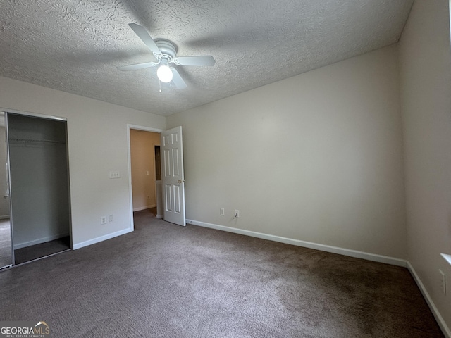 218 Osmanthus Way, Canton, GA 30114 - unfurnished bedroom with carpet floors, a textured ceiling, baseboards, a closet, and a ceiling fan