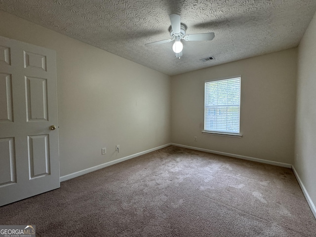 218 Osmanthus Way, Canton, GA 30114 - spare room featuring carpet flooring, a ceiling fan, baseboards, and a textured ceiling