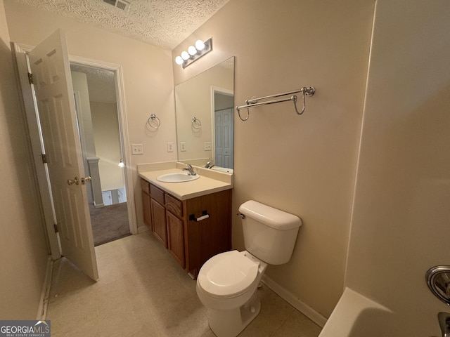 218 Osmanthus Way, Canton, GA 30114 - bathroom with toilet, a textured ceiling, tile patterned flooring, and vanity