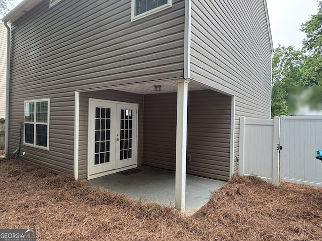 218 Osmanthus Way, Canton, GA 30114 - view of property exterior with french doors, a patio area, a gate, and fence