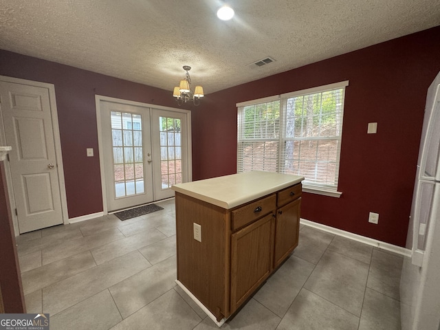 218 Osmanthus Way, Canton, GA 30114 - kitchen with a chandelier, baseboards, french doors, light countertops, and a textured ceiling