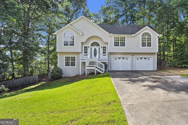 74 Rotunda Ct, Dallas, GA 30157 - raised ranch featuring stairs, concrete driveway, a garage, and stucco siding