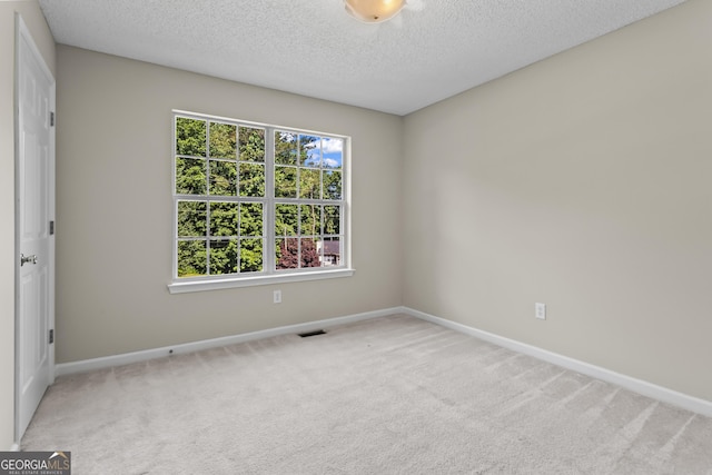 74 Rotunda Ct, Dallas, GA 30157 - carpeted spare room with baseboards and a textured ceiling