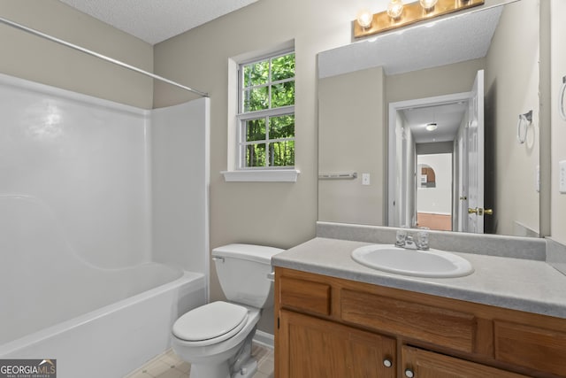 74 Rotunda Ct, Dallas, GA 30157 - bathroom featuring toilet, vanity, shower / tub combination, a textured ceiling, and tile patterned flooring