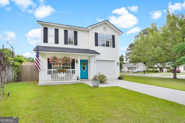 traditional home featuring a porch, a garage, and driveway