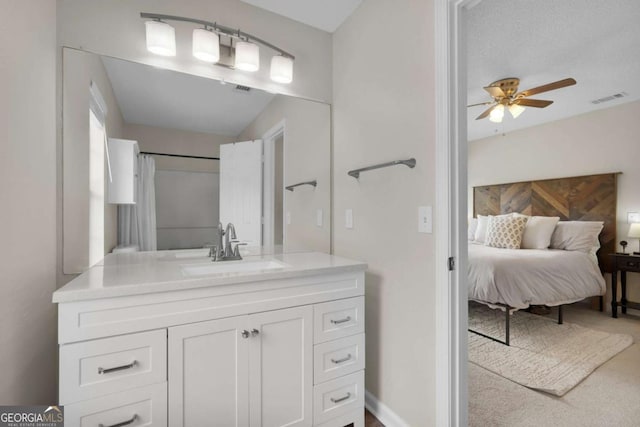 full bath featuring ceiling fan and vanity
