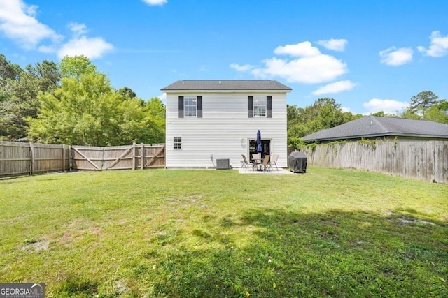 rear view of property featuring a patio area, central air condition unit, and a gate