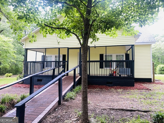 66 Kristys Path Dr, Eastanollee, GA 30538 - view of front facade featuring covered porch and crawl space