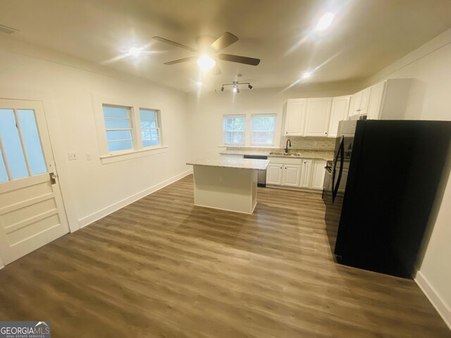 66 Kristys Path Dr, Eastanollee, GA 30538 - kitchen featuring a sink, ceiling fan, freestanding refrigerator, a center island, and white cabinets