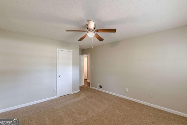 3661 Boring Rd, Decatur, GA 30034 - carpeted spare room featuring ceiling fan, baseboards, and a textured ceiling